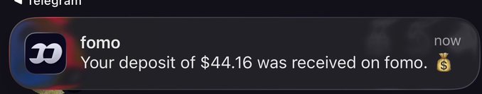 A Telegram notification from the 'fomo' app stating: 'Your deposit of $44.16 was received on fomo.' with a money bag emoji.