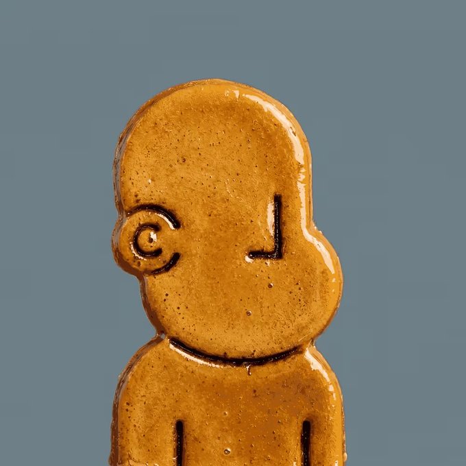 The image features a small, brown ceramic figurine of a person's head with an orange face. It appears to be made out of candy or sugar, giving it a unique and playful appearance. The figurine is positioned against a gray background, which contrasts nicely with its vibrant color. The caption below the image reads "Candy 1/1 sold for 1.069 ETH". This suggests that the figurine might have been purchased from an online marketplace or a collector's market where such items are being sold.