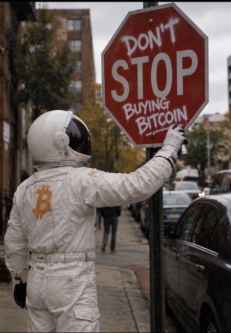 An astronaut in a white spacesuit with an orange Bitcoin logo sprays graffiti onto a stop sign, modifying 'STOP' to read 'DON'T STOP BUYING BITCOIN'.