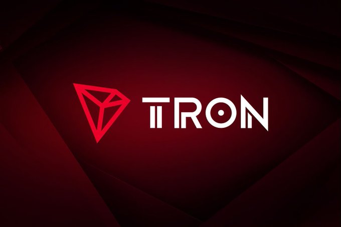 A simple yet iconic digital poster featuring the red Tron (TRX) logo and wordmark against a dark red, geometric background.