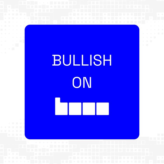 The image features a square blue sign with white text that reads "Bullish on Base". This message seems to be related to a game or competition, as indicated by the use of the word "base" in the text. The background of the image is a simple gray color, which contrasts nicely with the vibrant blue of the sign and makes it stand out even more.