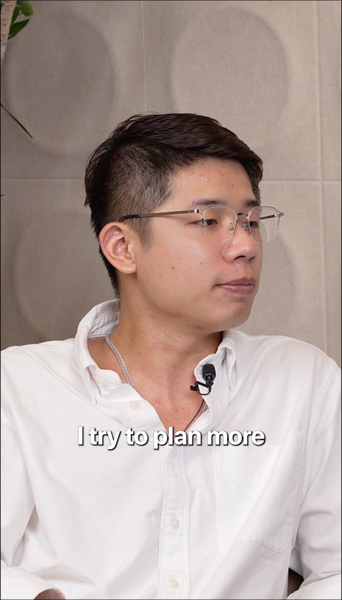 A man in a white shirt and glasses speaks thoughtfully, with the subtitle "I try to plan more" displayed on screen. The image visually reinforces the post's message about strategic planning and committing fully to one vision rather than hedging with a backup plan.