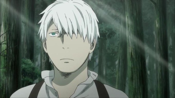 An anime screenshot featuring a young man with white hair and a single visible green eye, standing in a misty forest setting wearing a white shirt with suspenders.
