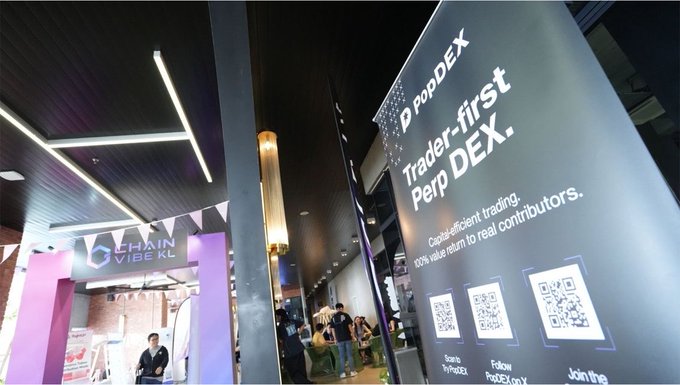 A large "PopDEX" banner promotes itself as "Trader-first Perp DEX" with captions reading "Capital efficient trading, 100% value return to real contributors," alongside three QR codes for community access, displayed at the Chain Vibe KL event where PopDEX connected with Web3 traders and partners in Malaysia.