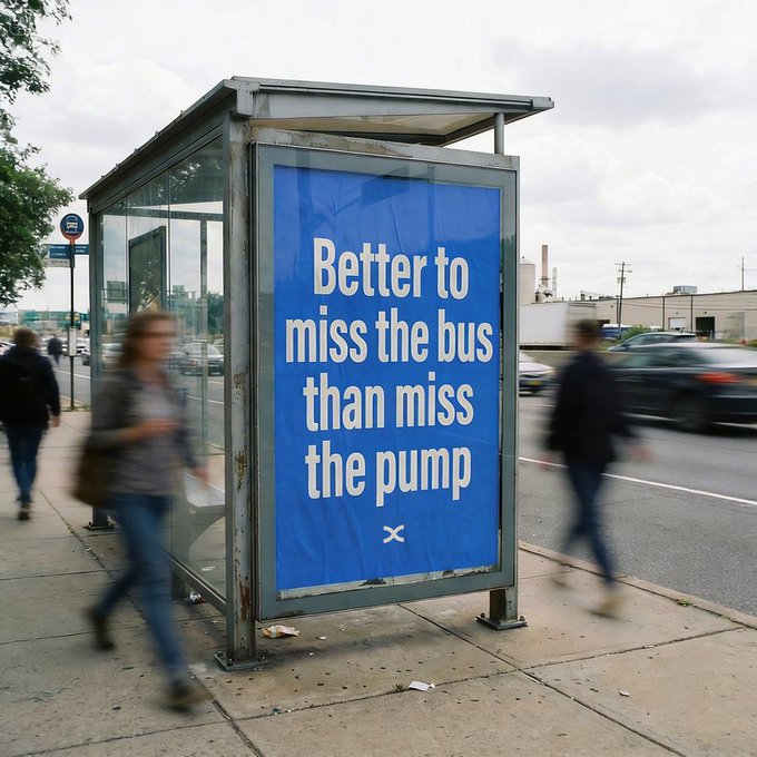 A blue advertisement at a bus stop reads "Better to miss the bus than miss the pump," with pedestrians rushing past on a cloudy city street. The phrase cleverly aligns with the post's message that prioritizing a workout ("the pump") over punctuality is worth it.