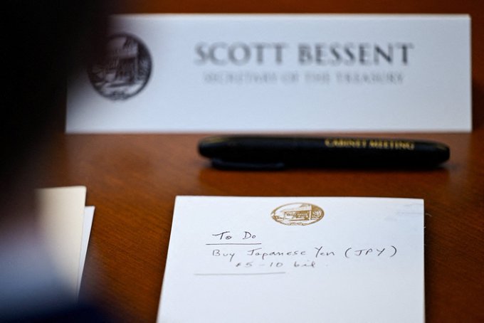 A to-do list with "Buy Japanese Yen (JPY) $5-10 bil." is seen on a desk, likely in preparation for a "Cabinet Meeting" for Scott Bessent, Secretary of the Treasury, hinting at a deliberate market move.