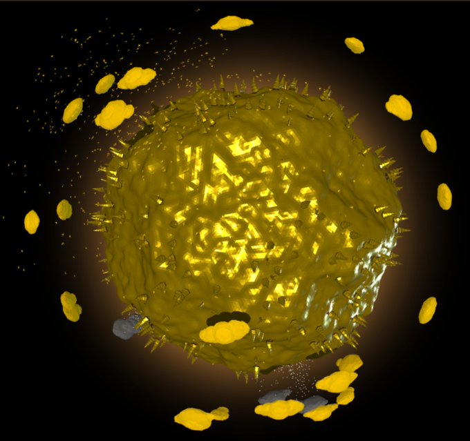 A spiky yellow spherical object is depicted against a black background, surrounded by smaller yellow floating particles.