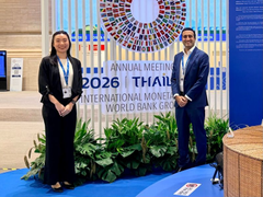 A woman and a man pose in front of a colorful "2026" display at the Annual Meeting of the Inter-American Development Bank (IDB) and World Bank Group. The image appears to be from a conference setting, likely unrelated to the CFTC announcement about Ripple's national bank charter plans mentioned in the post.