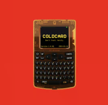 A Coldcard hardware wallet displayed against a red background, showing a locked screen with the text "COLD CARD" and "Cold is Trust. Verify." on Version 3.0.9 firmware. The image illustrates the Coldcard Q1 Bitcoin hardware wallet device relevant to the post about the hacking exploits.