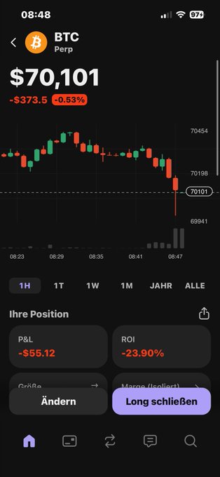 In the image, a person's cell phone screen displays an app called "BTC" along with Bitcoin prices, indicating that they are tracking cryptocurrency values. The phone is also showing information about the current Bitcoin trading positions. This indicates that the user may be involved in buying or selling Bitcoin or other cryptocurrencies on an exchange such as Mtgbtc.com.