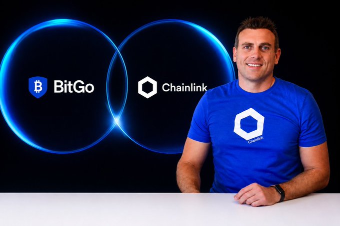 Promotional image showing a smiling man in a blue Chainlink t-shirt on the right, with overlapping blue neon circles containing the BitGo and Chainlink logos on the left.