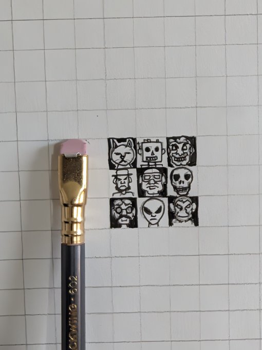 A paintbrush next to a 3x3 grid of black-and-white mini character portraits drawn on graph paper, including a cat, robot, skull, and alien faces.