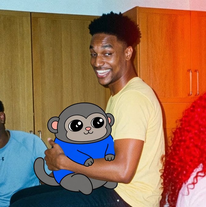 A young man smiles brightly while holding up a cartoon monkey sticker with big shiny eyes, appearing to playfully pose as if the animated character is real. The image accompanies a post promoting "$SMOLAPE TO BILLIONS" with a Solana token contract address, blending crypto hype with meme-style humor.