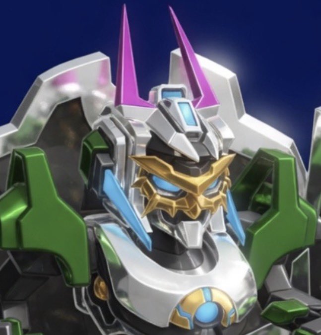 A detailed close-up of a colorful mecha/robot toy figure featuring silver, green, gold, and purple armor with pink horn-like protrusions and blue visor eyes.