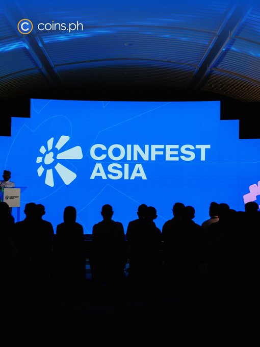 A crowd attends Coinfest Asia 2025 in Bali, where a large screen displays the event's logo alongside the Coins.ph branding, providing the backdrop for the panel "Stablecoins Are Becoming the New Financial Rails" featuring Coins.ph CEO Wei Zhou.