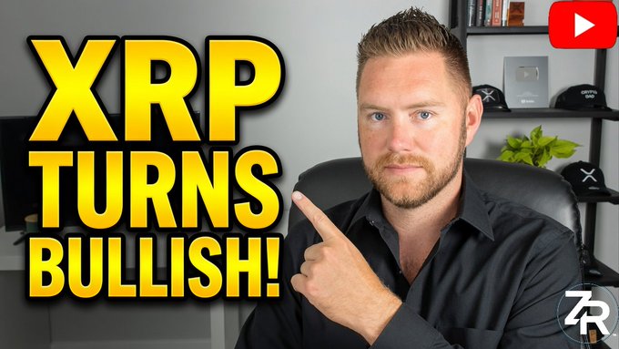 A man points at bold yellow text reading "XRP TURNS BULLISH!" while wearing a black shirt in front of a shelf, visually reinforcing the post's announcement of XRP's bullish shift following developments around the Clarity Act. The image serves as an attention-grabbing thumbnail for the linked YouTube video.