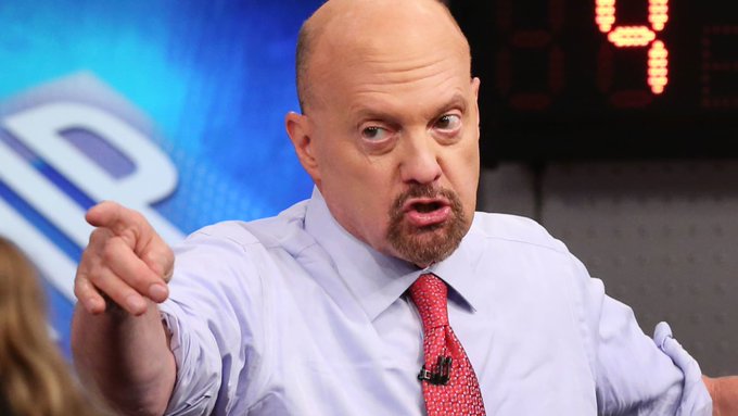 Jim Cramer, wearing a light blue dress shirt and red tie, gestures animatedly with an intense expression while speaking on his CNBC set, with the show's partial logo visible behind him. His fiery, confrontational posture in the image pairs ironically with the contradictory post text, which claims he urged viewers to buy Bitcoin while simultaneously reporting an overbought RSI of 84 and recommending selling all crypto.