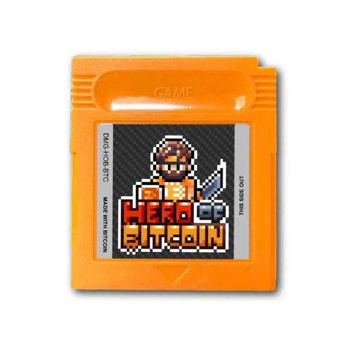 An orange Game Boy-style cartridge labeled 'HERO OF BITCOIN' featuring pixel art of a character holding a sword, with text 'DMG-HOB-BTC', 'MADE WITH BITCOIN', and 'THIS SIDE OUT'.