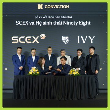 A signing ceremony at the Conviction event showing representatives from SCEX and the IVY ecosystem shaking hands on stage, with text reading 'Lễ ký kết Biên bản Ghi nhớ SCEX và Hệ sinh thái Ninety Eight'.