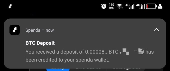 A mobile phone screenshot of a notification from the Spenda app stating 'BTC Deposit - You received a deposit of 0.00008... BTC has been credited to your spend wallet.'