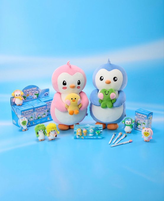 A collection of Planet Zoo plush toys and merchandise, including a pink penguin, a blue penguin, and various smaller figures, displayed on a light blue background.