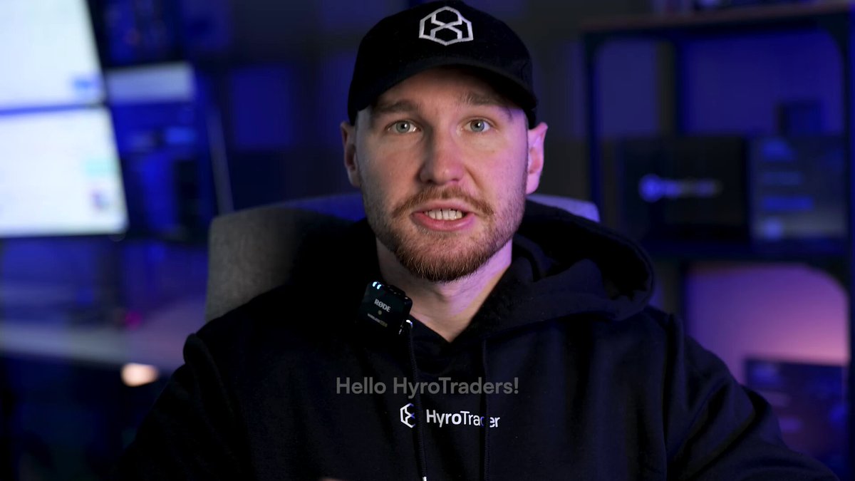 In the image, there is a man sitting down wearing a black sweatshirt with the words "Hello HyroTraders" printed on it. The man appears to be a trader or an expert in trading strategies within the cryptocurrency market. The image also contains text that mentions Bitcoin prices and trading profits, as well as some text about the importance of consistency when trading, such as avoiding overtrading and building momentum trading habits. The overall focus of this post is on fair value gaps, momentum trading, and other aspects related to trading cryptocurrencies like Bitcoin.