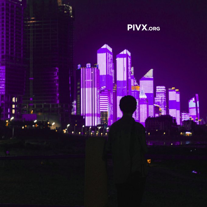 A silhouetted figure stands before a vibrant nighttime cityscape of illuminated skyscrapers bathed in purple light, with the text 'PIVX.org' displayed in the sky.