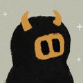A simple illustration of a black character with two large rectangular eyes and orange/yellow horn-like features on top of its head, against a light background with small star accents.