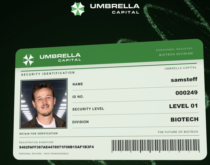 An 'Umbrella Capital' security identification card for 'samsteff' in the Biotech Division features a photo of a young man with the tagline 'THE FUTURE OF BIOTECH.'