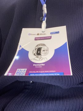 An event badge hanging from a lanyard, marked 'Favourite Person' for a 'Security Pro August 2025' event, featuring a QR code and a stylized head graphic.