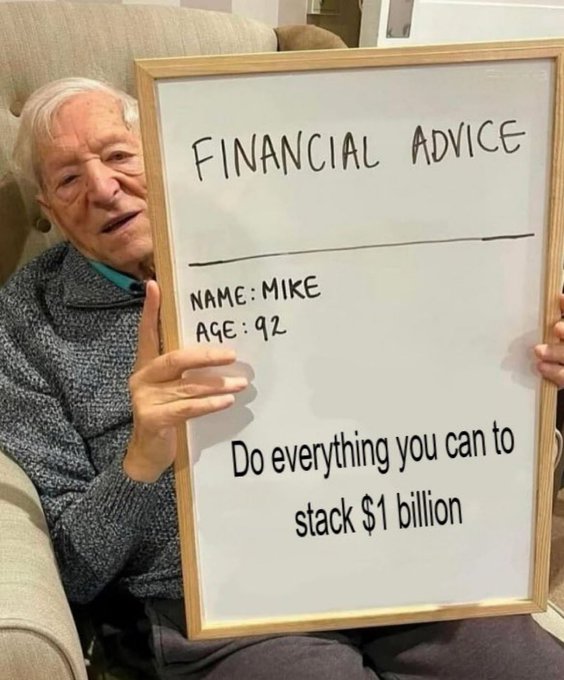 An elderly man named Mike, age 92, holds a whiteboard titled "FINANCIAL ADVICE" that advises: "Do everything you can to stack $1 billion," humorously presenting an absurdly ambitious wealth goal as straightforward financial guidance.
