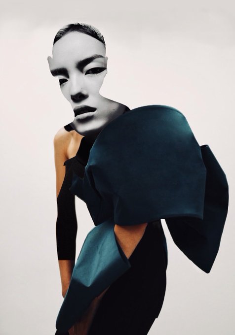 A figure wearing a white theatrical mask stands against a pale background, draped in a black garment with dramatic, oversized sculptural sleeves. The image embodies the post's theme of "Unfinished Presence," with the mask symbolizing anonymity and the abstract garment suggesting an incomplete, transitional identity—fitting for a 1/1 NFT edition listed for 200 XTZ on objktcom.