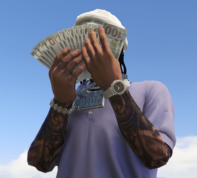 A person wearing a white headwrap and a lavender shirt covers their face with a fanned-out display of $100 bills, accessorized with a diamond-encrusted watch and chunky chain. The image visually echoes the post's "gm" (good morning) greeting and "where's today's wins coming from?" by flaunting stacks of cash as the answer to daily success and prosperity.