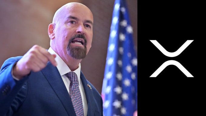 John Deaton gestures emphatically in front of an American flag alongside the XRP logo, referencing his credit to 75,000 XRP holders for helping Brad Garlinghouse and Chris Larsen resist SEC pressure.
