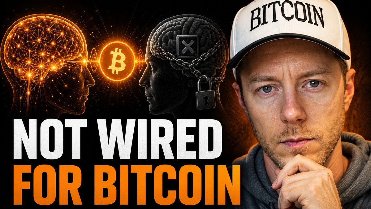 The image features an advertisement for Bitcoin, with two brain images overlaid on top of each other. The text "Not Wired For Bitcoin" is written above one of the brain images, while the other brain image is positioned below the text. A man wearing a hat and thinking about something else can be seen in front of these brain images.