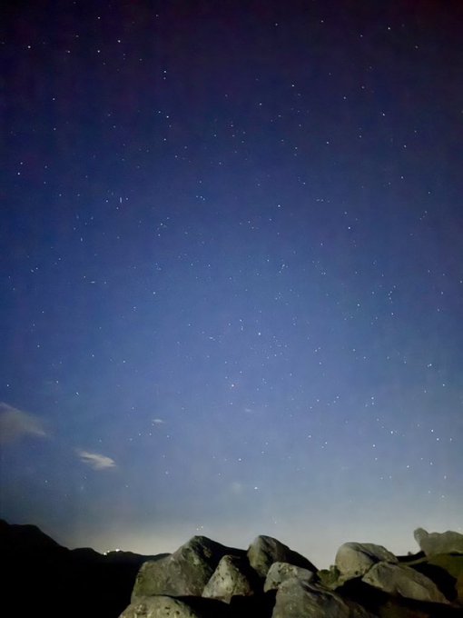 A starry night sky stretches above a silhouette of rocky terrain, with countless stars scattered across the deep blue expanse and a faint glow of distant lights on the horizon.

The image's tranquil, vast nighttime scene contrasts with the post's forward-looking message about technological progress, suggesting that while the night sky represents the steady, familiar backdrop, the real "shift" in blockchain development is quietly taking place out of view—much like the unseen depths beyond the visible horizon.