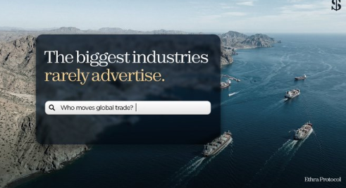 The image shows an aerial view of large cargo ships traversing ocean waters near rocky coastlines, overlaid with a search box reading "The biggest industries rarely advertise. Who moves global trade?" and credited to "Ethra Protocol." It visually reinforces the post's message by depicting the massive shipping industry—highlighting that global trade, often overlooked, is being brought on-chain by @EthraShip as part of real-world asset (RWA) tokenization.
