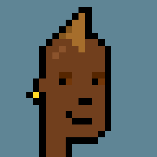 A simple pixel art image depicts a stylized brown face with a small smile and what appears to be a small yellow and red detail on its left side, set against a blue background.