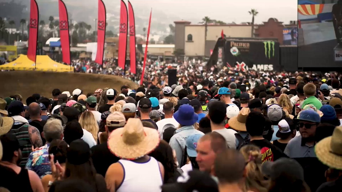 A massive crowd of people, many wearing hats, gathers at an outdoor X Games event, with visible branding including "Pacifico," "Monster," and "X Games" on banners, suggesting a major action sports competition. The image likely illustrates the "hi MoonPay will be on ESPN all weekend" post by showcasing the high-energy, ESPN-broadcasted X Games setting where the brand's advertisement may appear.