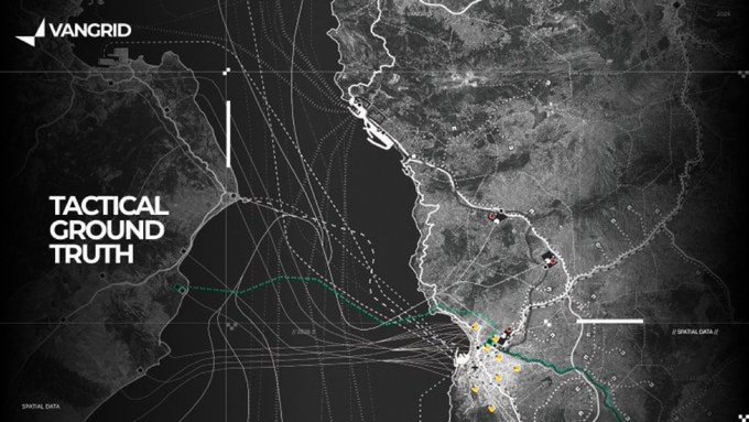 A black-and-white tactical satellite map titled 'TACTICAL GROUND TRUTH' by VANGRID, showing a coastal region with strategic data points, movement indicators, and a notable cluster of activity near the shoreline.