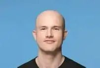 A bald man with a neutral expression appears against a light blue background, likely representing a figure related to Robinhood or the cryptocurrency industry. The image accompanies news about Robinhood's blockchain surpassing Base in daily active users.