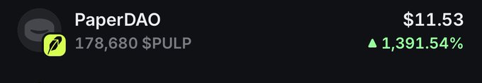 A dark-themed cryptocurrency ticker displays 'PaperDAO' with a price of '$11.53' and a green upward trend showing '▲ 1,391.54%' alongside a token balance of '178,680 $PULP'.