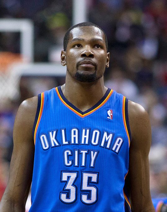 Kevin Durant, wearing his Oklahoma City #35 jersey, is shown here as the NBA superstar behind a savvy early-stage investment in AI startup Hugging Face, which is reportedly turning his initial $250,000 into a significant payout. The image highlights Durant's reputation as a smart tech investor beyond basketball, in stark contrast to his peers' questionable crypto and niche startup choices.