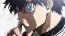 The image shows a close-up of an anime character with blue eyes and glasses. The character has their chin resting on their fingers, giving them a mysterious or intense expression as they look off into the distance. They appear to be in a contemplative mood while wearing a t-shirt. In the background, there is text that appears to be related to sports markets, although it is not clear what this connection means or how it fits into the overall scene. The context of the character's expression and the surrounding text suggest an intriguing or unexpected story unfolding within the image.