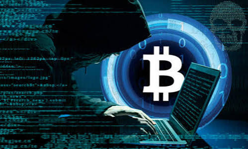 A hooded figure types on a laptop in front of a Bitcoin symbol, with code streams in the background, depicting a cryptocurrency hacker.