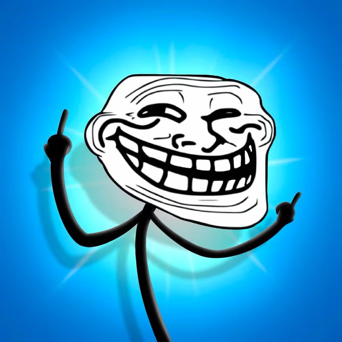 The image features a cartoon character with two arms and legs, wearing a mask and making a peace sign gesture while standing against a blue background. The caption of the image reads "I changed my mind and just made a certified regard move in this boring market I aped into @Troll_ NFTs even after doing my DYOR... fully knowing they're all the same and it's 100% a pure IP gamble".