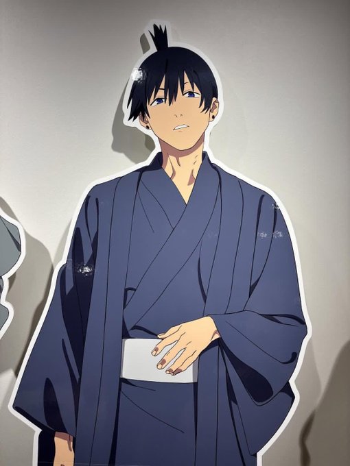 An anime-style illustration shows a character with dark hair tied in a small topknot, wearing a dark blue traditional kimono/yukata with a white obi sash, standing against a plain wall. The image appears unrelated to the morning crypto tweet, serving simply as a stylized character graphic accompanying the post.