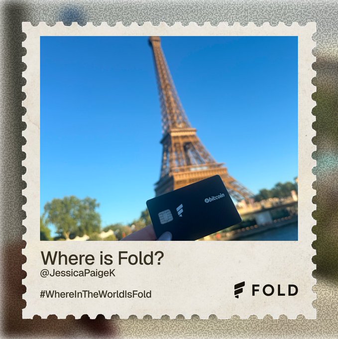 A Polaroid-style photo showing a hand holding a black Fold Bitcoin card in front of the Eiffel Tower, captioned 'Where is Fold?' by @JessicaPaigeK with the hashtag #WhereInTheWorldIsFold.