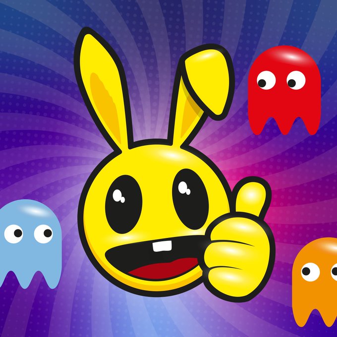 A cartoon image featuring a yellow bunny-like character giving a thumbs-up in front of a Pac-Man style swirl, surrounded by three colorful ghosts (blue, red, orange).