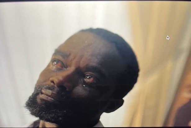 A man with tears welling in his red, bloodshot eyes stares upward with an emotional, tearful expression against a softly lit background. His tear-streaked, anguished face perfectly embodies the desperate sentiment of the post, conveying the overwhelming emotion that comes with finally seeing $50.